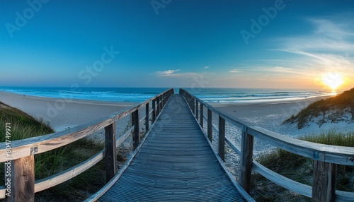 panorama view of footbridge to beach at sunrise © Dayami