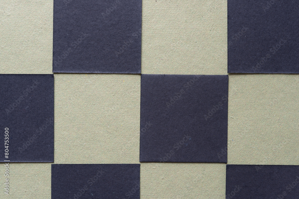 blank checkered background composed of black tiles on green paper blank checkered background composed of black tiles on green paper