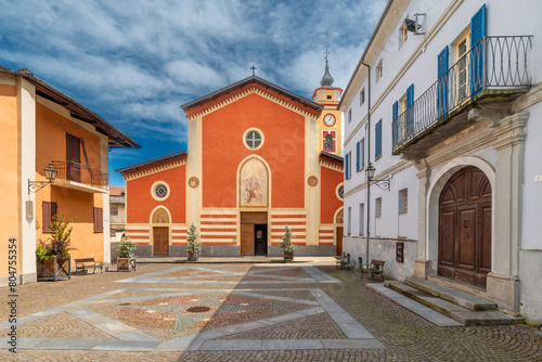 Sanfront, Cuneo, Italy - May 03, 2024: the parish church of San Martino in Piazza Ferrero paved with porphyry and stone slabs in the historic village in the Po Valley