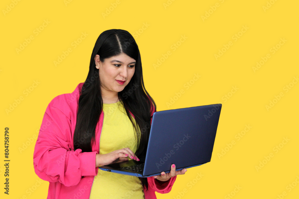 Naklejka premium 30-year-old Latina woman uses her laptop to work, take courses, shop, pay and dating online