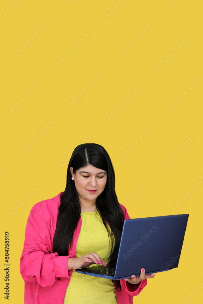 Naklejka premium 30-year-old Latina woman uses her laptop to work, take courses, shop, pay and dating online