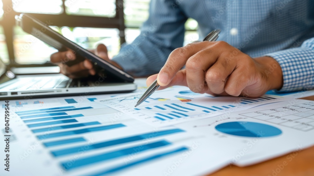 man in suit analyzing some bar graphs. innovation concept, work, market, study, analyst, resources man in suit analyzing some bar graphs. innovation concept, work, market, study, analyst, resources