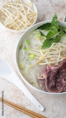 pho bo, vietnamese raw beef and rice noodle shoup