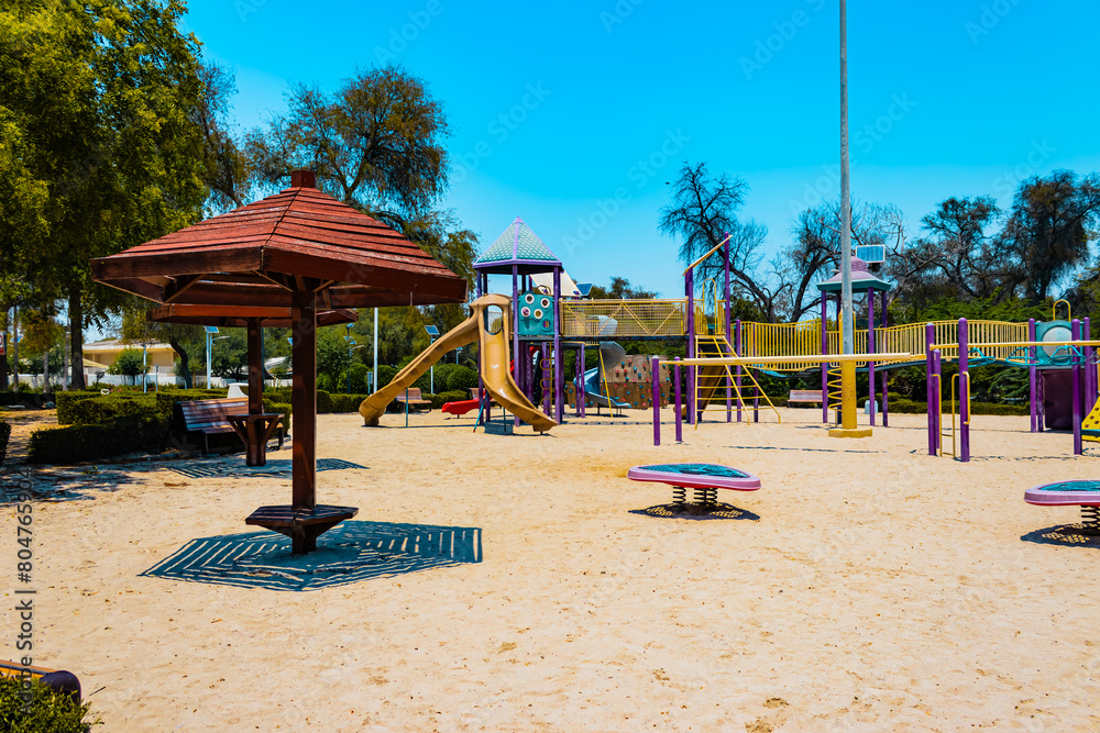 children's playground in the park, view of the amusement park during the daytime children's playground in the park, view of the amusement park during the daytime