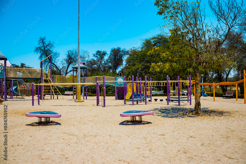 children's playground in the park, view of the amusement park during the daytime children's playground in the park, view of the amusement park during the daytime