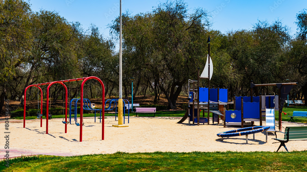 children's playground in the park, view of the amusement park during the daytime children's playground in the park, view of the amusement park during the daytime