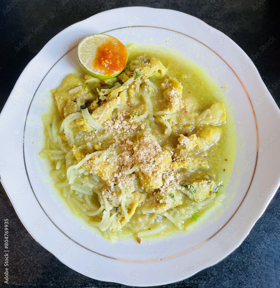 Lamongan Chicken Soto (Soto Ayam Lamongan) served with shredded chicken ...