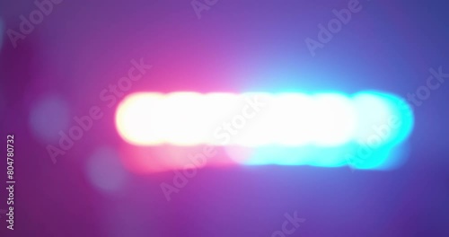 Out of focus crime scene, police flashers on emergency vehicles, police, Emergency Situations, utilities. Flashing light red and blue.
