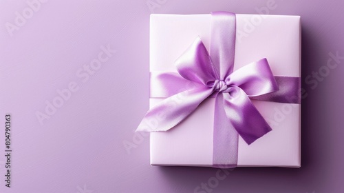 A festive gift box ribbon is elegantly displayed against a soft violet pastel backdrop leaving room for a personalized message This versatile holiday greeting card is perfect for Valentine 
