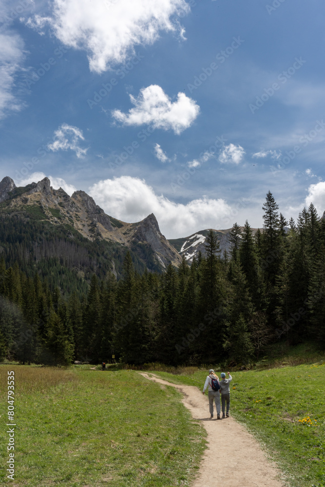 Fototapeta premium Hiking in the mountains in early spring 