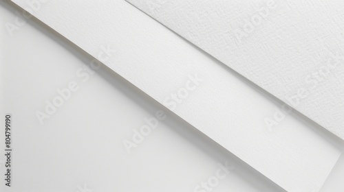 White-on-white composition: White wall, white paint, and a subtle line on white paper. Contemporary minimalism.