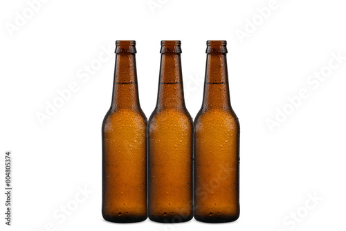 three bottles of unlabeled beer, condensed, cold