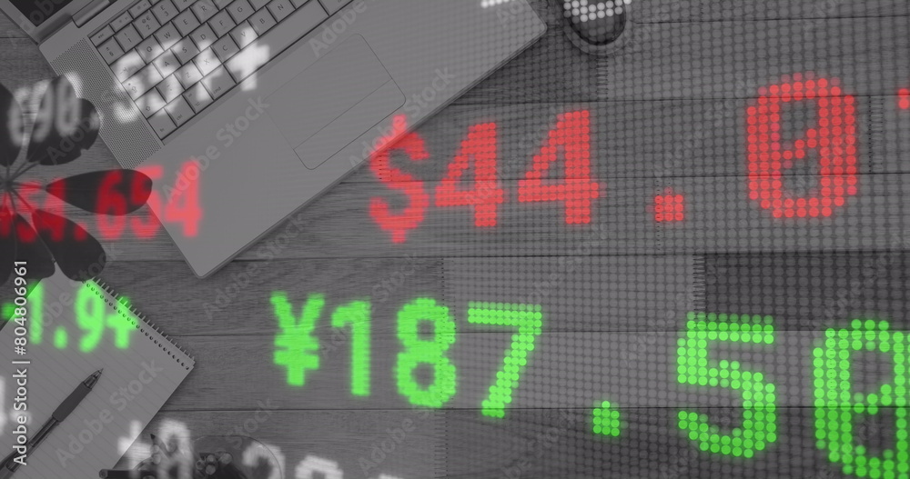 Image of financial data processing over desk with laptop Image of financial data processing over desk with laptop