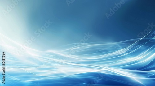 Abstract waves of light flowing gracefully across a blue background. monochromatic color scheme featuring various shades of blue that transition from light to dark