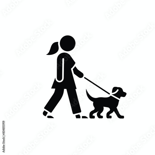 Silhouette of a woman walking her dog on a leash.