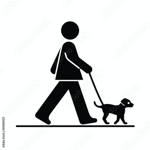 Silhouette of a person walking a small dog on a leash.