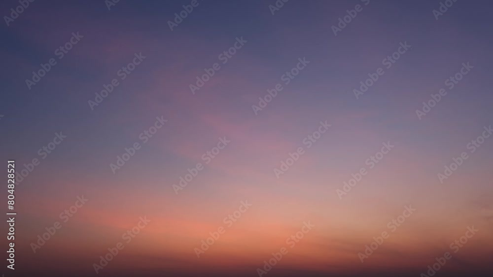 The fast-paced motion of clouds across the sunrise sky, a time lapse capturing the ever-changing beauty of nature's landscapes from dawn to dusk. Wind and Infinite concept. Time-lapse. Sky background.