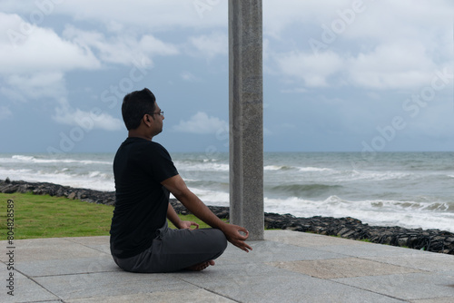 A man practicing yoga at beach in morning.  Jogging, workout, exercise, healthy life, diet, lifestyle, sedentary, active, fit, fresh, fitness, periods, sunlight, muscle, work life balance BeH3althy