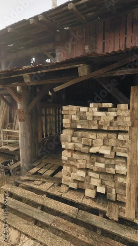 Wallpaper Mural A wooden shack with stacks of logs in front of it Torontodigital.ca