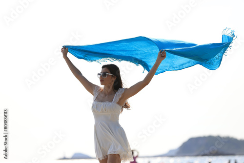 Joyful beautiful woman with white dress walk relax on tropical beach , summer vacation and travel