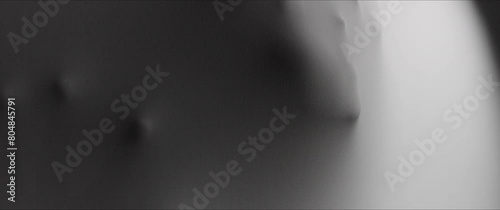 Woman's hands and face extrude from the wall surface photo