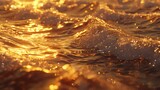 Close-up of golden ocean waves reflecting sunset light.