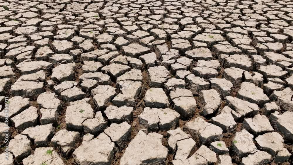 A bird's eye perspective reveals parched earth, cracked and barren, a testament to severe drought. It underscores environmental crises, urging sustainable water management.
A bird's eye perspective reveals parched earth, cracked and barren, a testament to severe drought. It underscores environmental crises, urging sustainable water management.