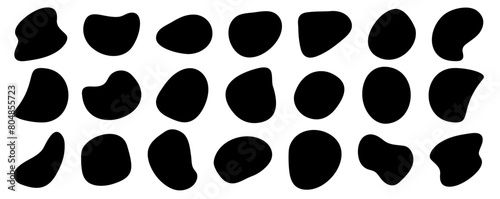 Black vector organic fluid amoeba blob elements set. Irregular pebble stone shapes background. Various quirky free form organic liquid water puddle irregular shapes. Freeform cow or Dalmatian stains