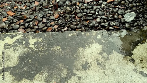 The view of drizzling rain in front of the house