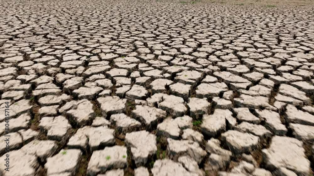 From above, a stark tableau unfolds, parched terrain, cracked and forsaken. Drought's cruel touch lays bare the land, signaling a dire call for environmental and agricultural intervention.
From above, a stark tableau unfolds, parched terrain, cracked and forsaken. Drought's cruel touch lays bare the land, signaling a dire call for environmental and agricultural intervention.