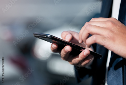 Hands, businessman and phone in city with news update, typing and internet search. Employee, app and holding mobile by sidewalk with web connection for reading email, online conversation and text