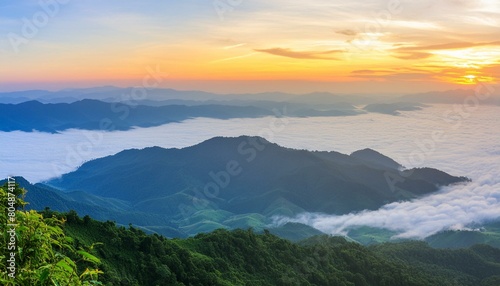 green mountain with fog and sunrise twilight sky at background