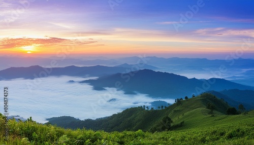 green mountain with fog and sunrise twilight sky at background © Santri
