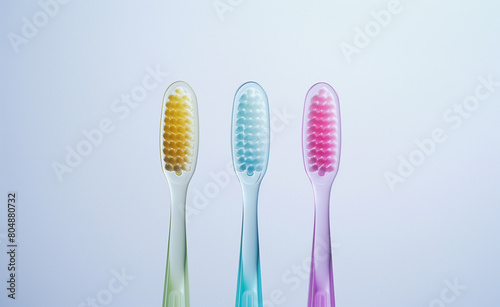 Three toothbrushes in a straight line