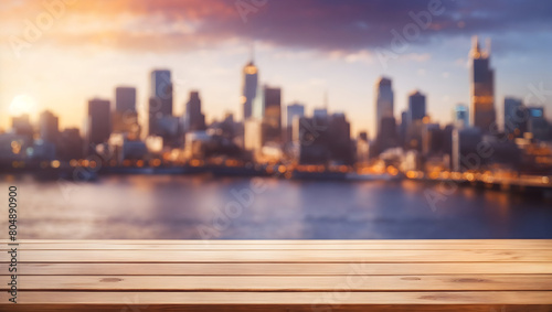 Image of empty wooden table in front of abstract blurred city background