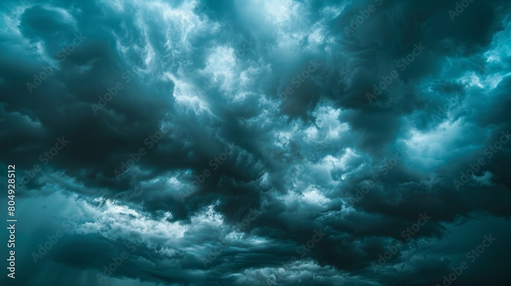 A dramatic scene unfolds as dark, heavy clouds converge, signaling the imminent arrival of a storm A dramatic scene unfolds as dark, heavy clouds converge, signaling the imminent arrival of a storm