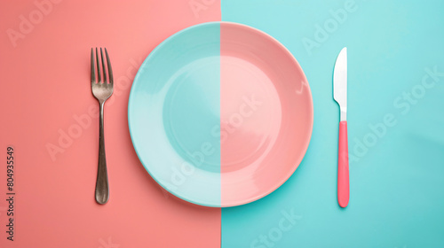 Plate and set of cutlery on color background