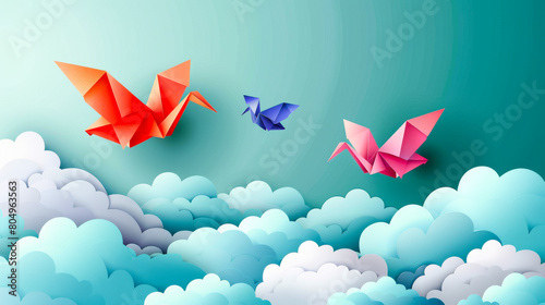 Colorful Origami Cranes Flying Above Clouds. photo