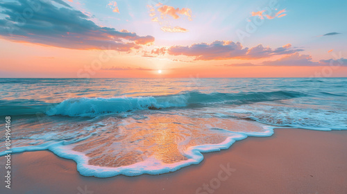 Stunning beach sunset with soft waves washing over golden sand under a beautiful orange sky. © khonkangrua