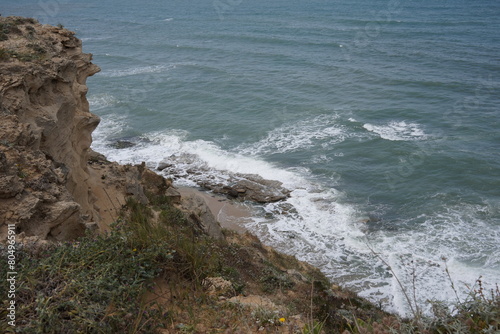 Mediterranean sea in spring. Deserted shorekurkar sandstone cliff nature reserve, high above the Mediterranean sea coastline between Herzliya and Netanya towns, Israel.