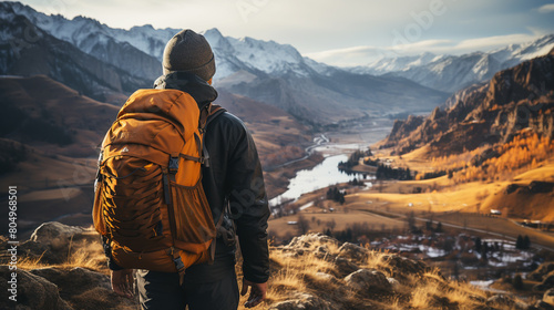 Man hiking at sunset mountains with heavy backpack Travel Lifestyle wanderlust adventure concept summer vacations outdoor alone into the wild