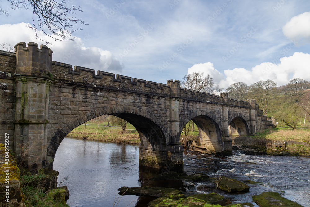 Fototapeta premium A stone built bridge which is built over a small river