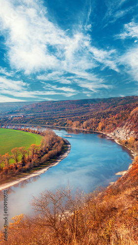 Rural landscape. River with a rocky bank in autumn. Beautiful nature. Vertical banner © vvvita