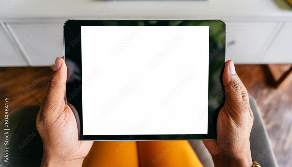 Mockup image of a hand holding digital tablet with blank white desktop screen Mockup image of a hand holding digital tablet with blank white desktop screen