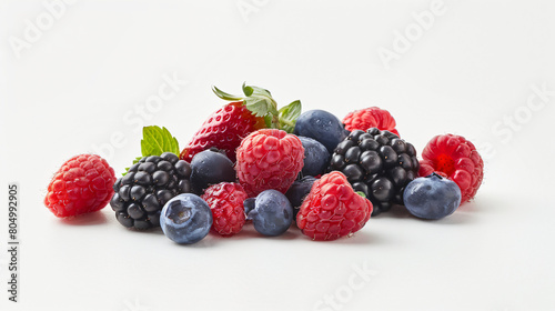 Tasty ripe berries on white background