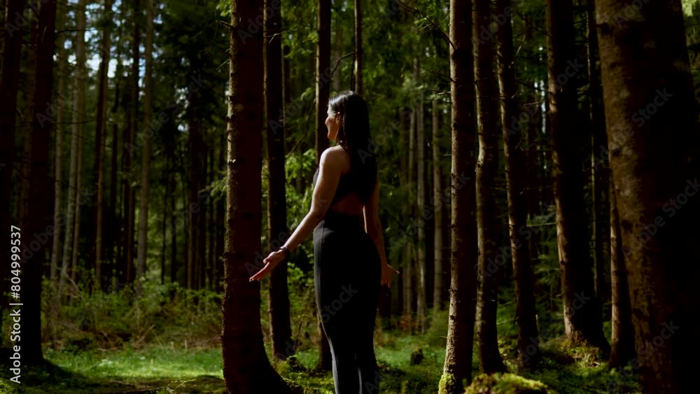 A woman stands on boards with nails in a fairy forest. Feet stand on boards Sadhu. Yoga and meditation concept A woman stands on boards with nails in a fairy forest. Feet stand on boards Sadhu. Yoga and meditation concept