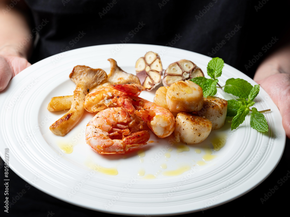 Grilled shrimp and scallops on a plate Grilled shrimp and scallops on a plate