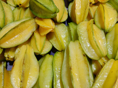 Fresh and yellow star fruit (Averrhoa carambola), a type of tropical fruit, texture.