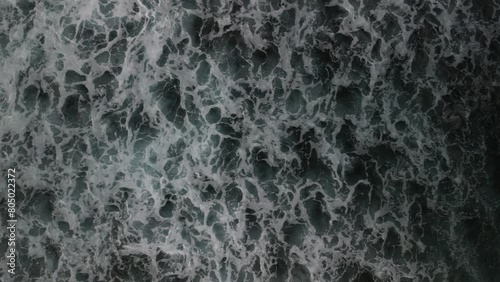 Waves that break on the reef on the coast of the island of Mauritius and slowly run out towards the island.