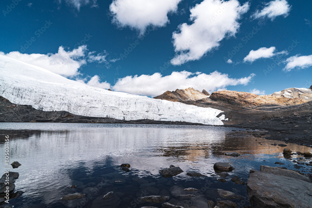 pastoruri glacier landscape with a laguna in snow covered andes in the national park Huascarán